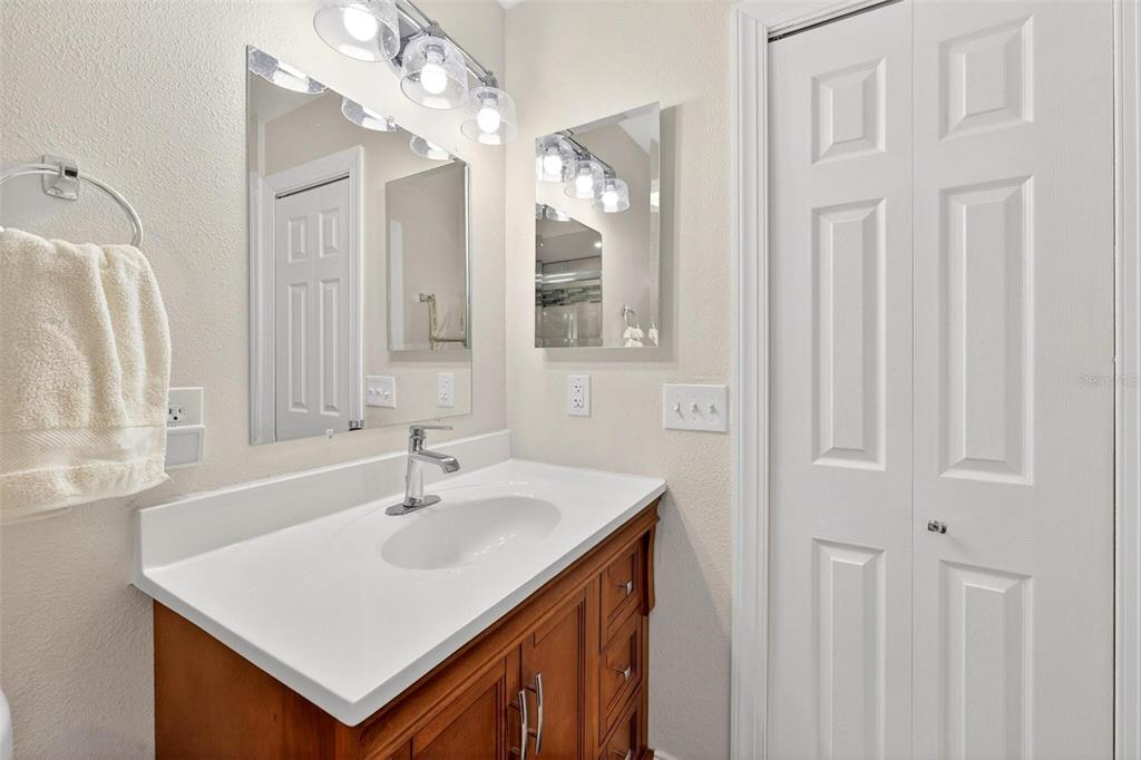 1024 Timor Avenue Orlando, FL 32804 - Photo 27 of 51 a bathroom with a sink a vanity and a mirror