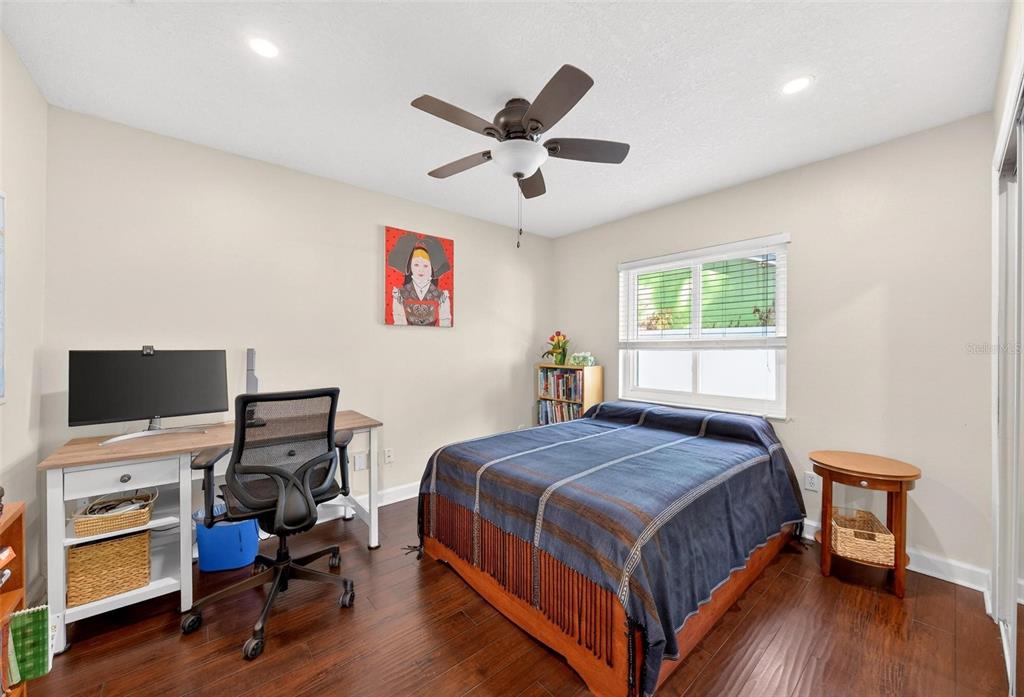 1024 Timor Avenue Orlando, FL 32804 - Photo 31 of 51 a bedroom with a bed and a desk