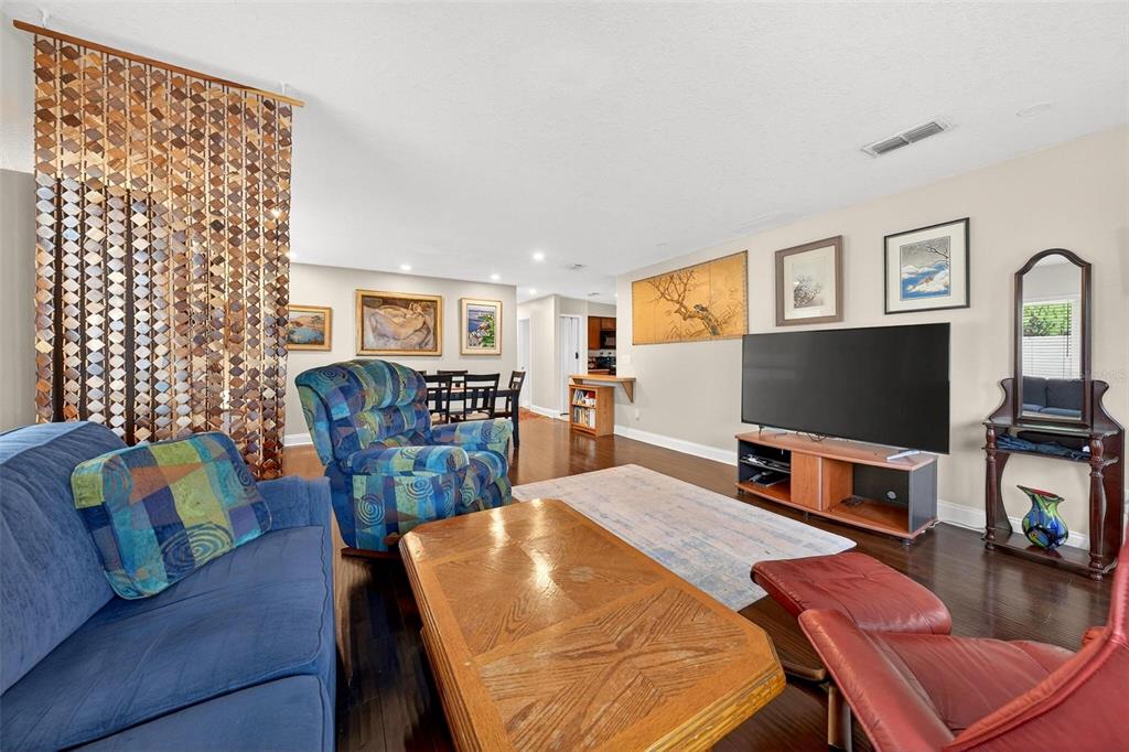 1024 Timor Avenue Orlando, FL 32804 - Photo 9 of 51 a living room with furniture and a flat screen tv