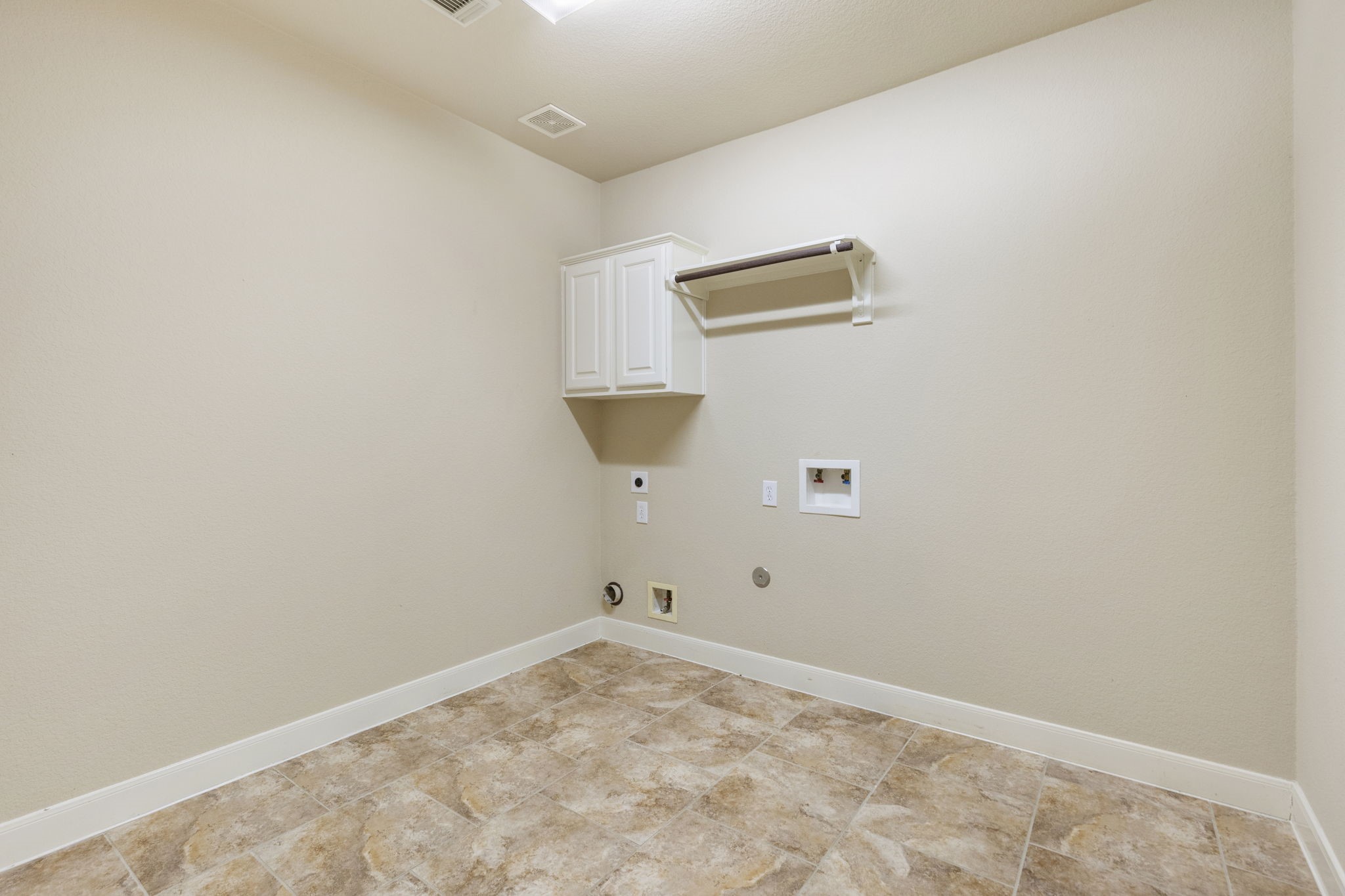 19222 Senterra Lakes Boulevard Spring, TX 77379 - Photo 30 of 45 arge dedicated utility room complete with built-in cabinetry, a utility sink, and plenty of room for your washer and dryer.
