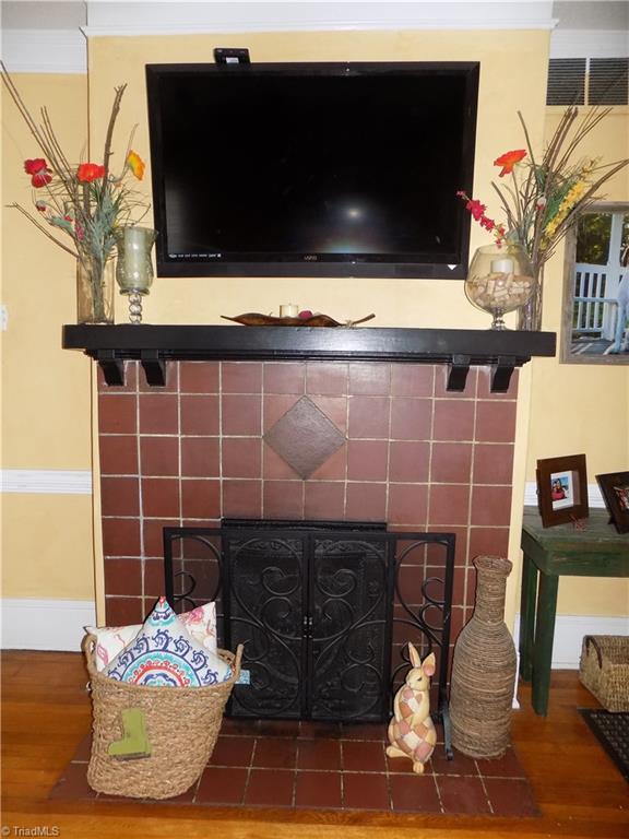 1013 North Hamilton Street High Point, NC 27262 - Photo 7 of 30 Original Fireplace Setting with gas log insert. Television and bracket remain.