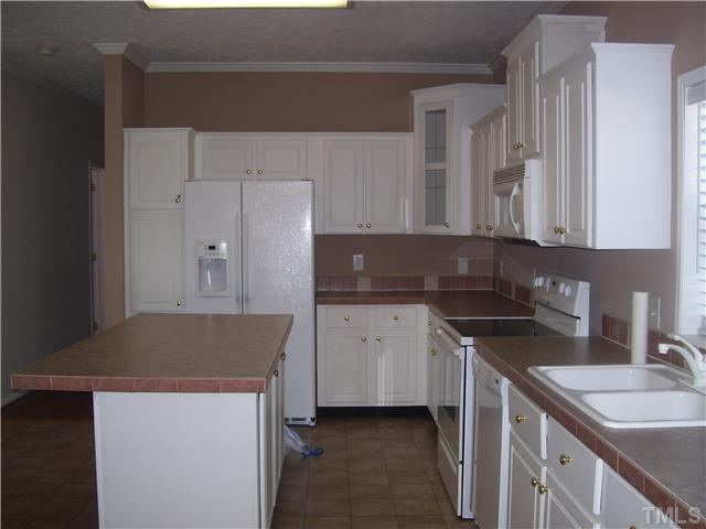 5252 Meadowbrook Road Benson, NC 27504 - Photo 8 of 12 a kitchen with a sink and cabinets