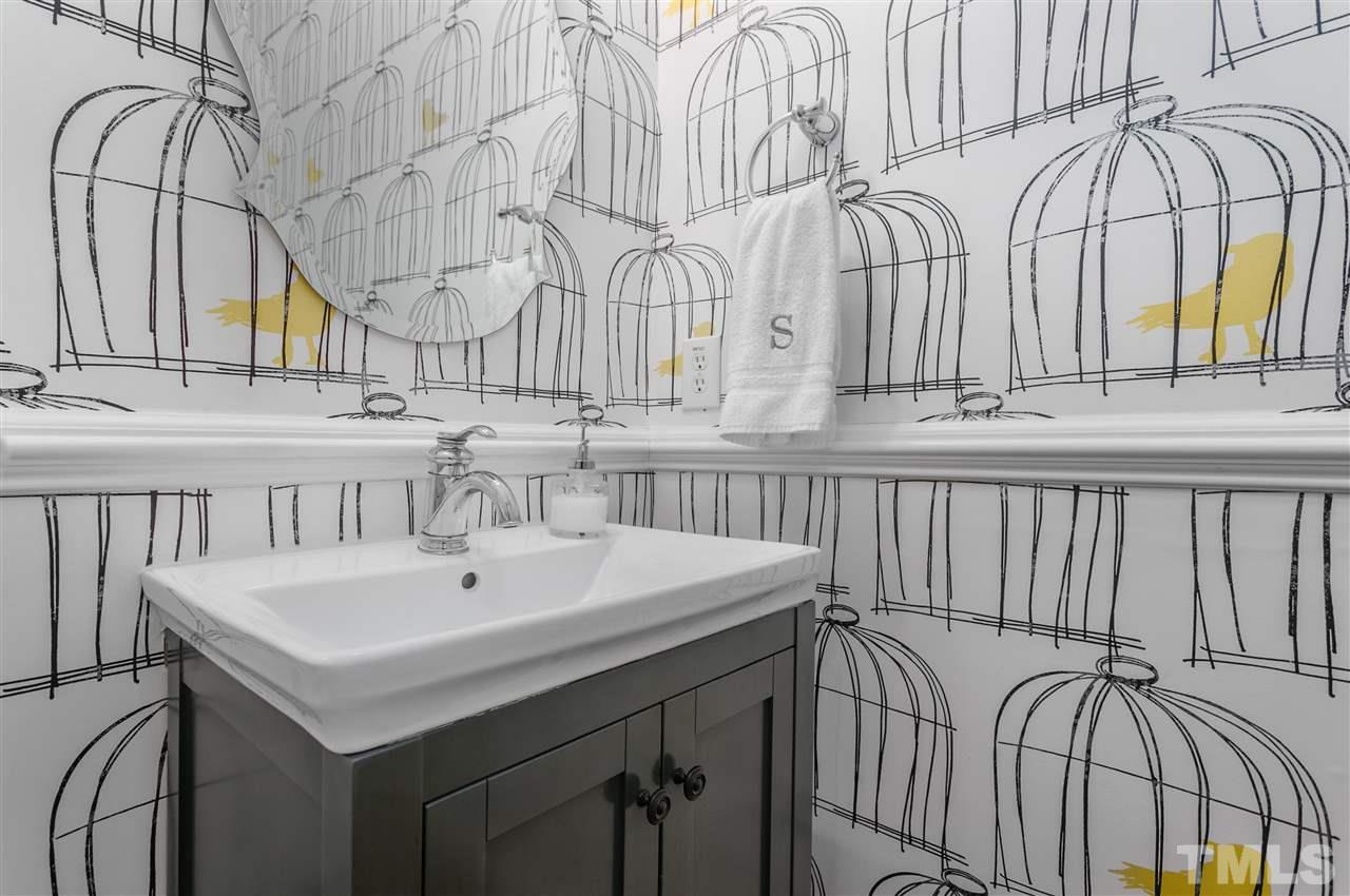 8617 Churchdown Court Raleigh, NC 27613 - Photo 14 of 30 a bathroom with a sink and a mirror