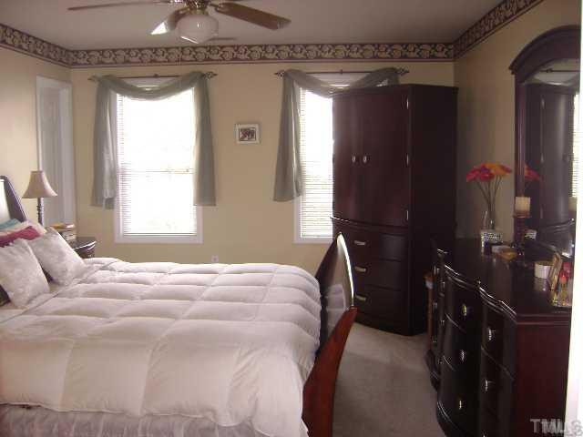 The spacious master bedroom features a walk-in closet and a master bath with a large soaking tub, separate shower, granite vanity, and tile flooring. Master Bath/Spa