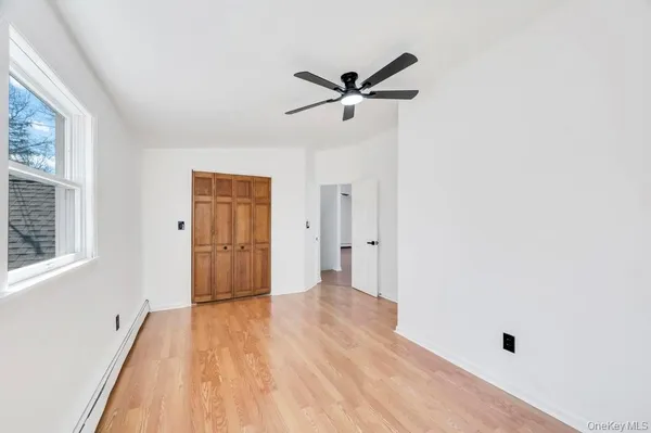 a view of a livingroom with wooden floor