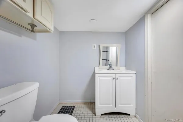 a bathroom with a sink toilet and vanity