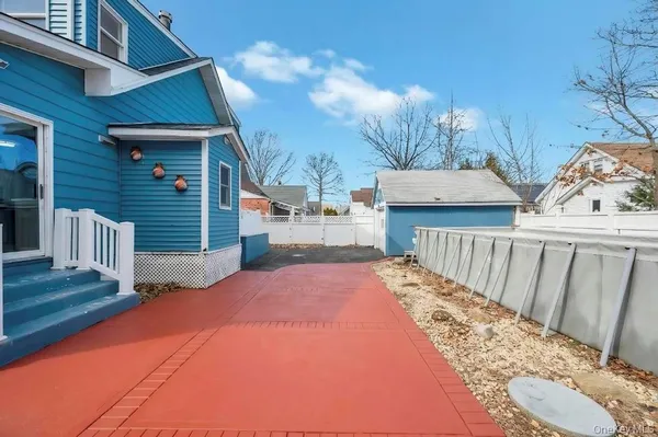 a balcony view with two chairs