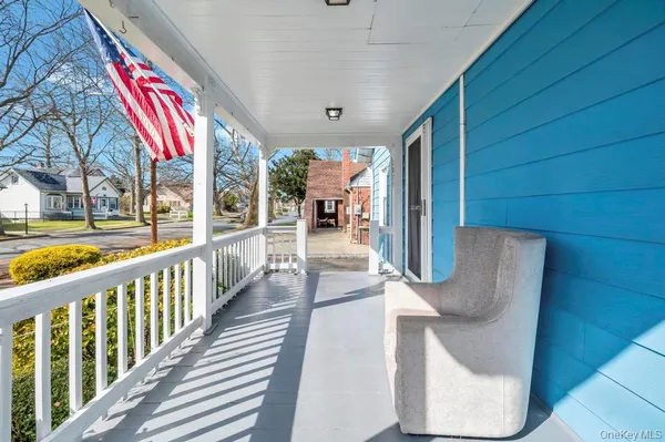 a view of a chairs and table in balcony