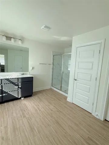 a room with a bed and a bathroom