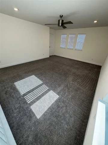 a view of a hallway with wooden floor and entryway