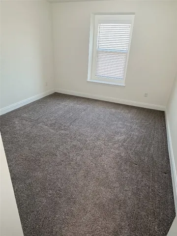 an empty room with wooden floor