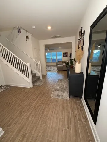 a living room with furniture and a rug