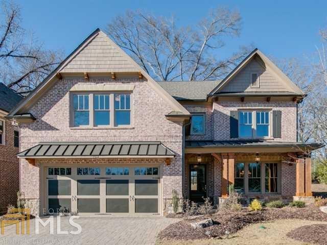 103 Walden Square Way, Unit 2 Decatur, GA 30030 - Photo 1 of 1 a view of a brick house with large windows