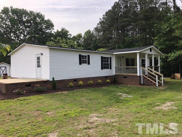 860 Thanksgiving Fire Road Selma, NC 27576 - Photo 3 of 23 a view of a house with a yard