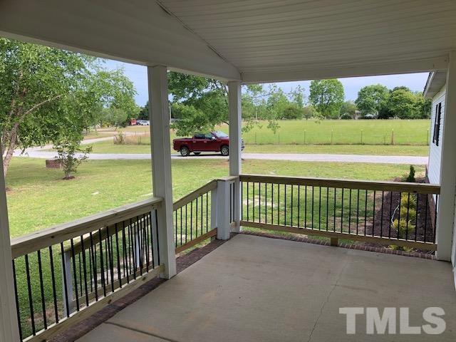860 Thanksgiving Fire Road Selma, NC 27576 - Photo 7 of 23 a view of outdoor space with deck and yard