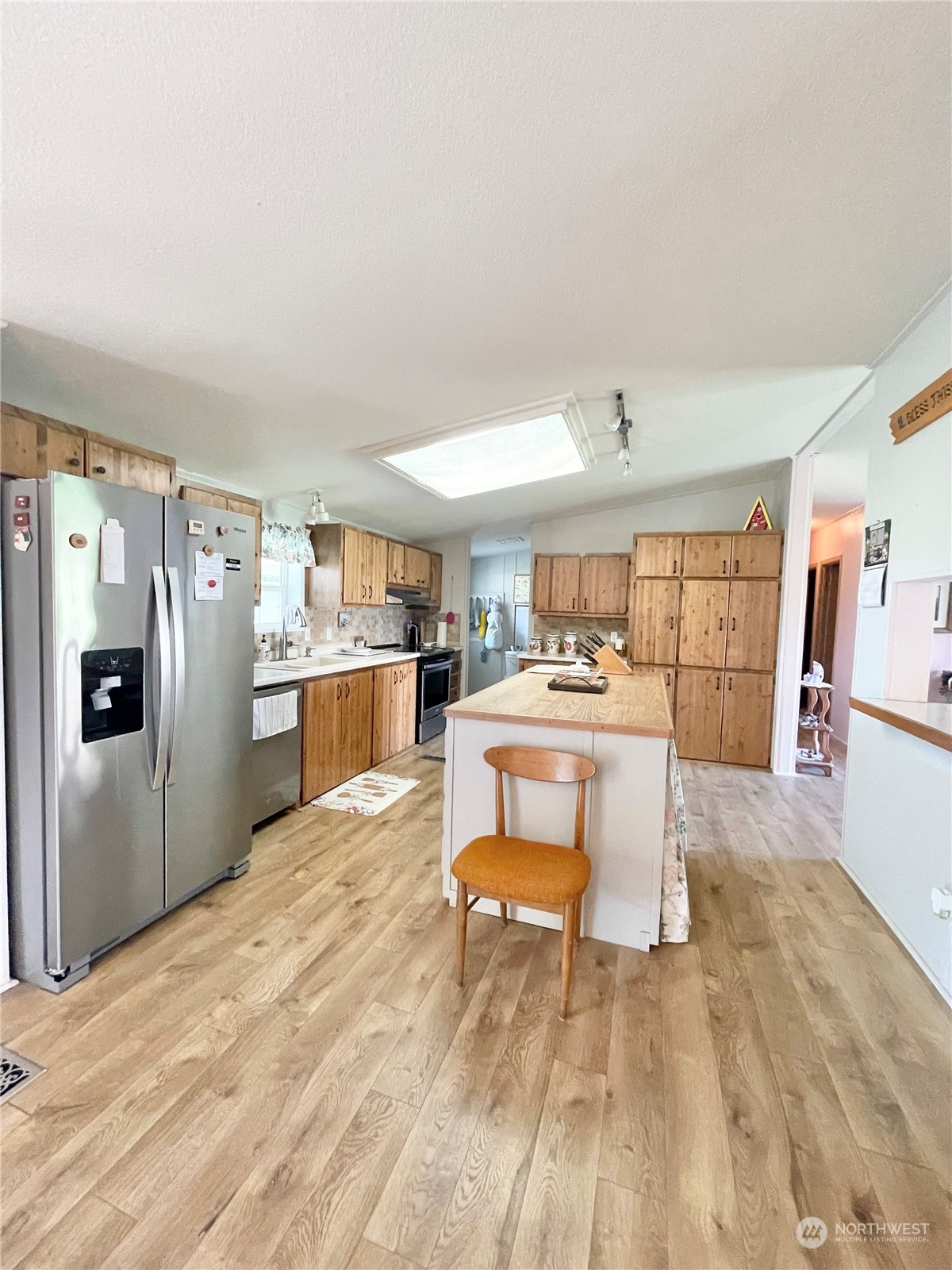 92 Danker Cutoff Road Okanogan, WA 98840 - Photo 3 of 35 a living room with stainless steel appliances kitchen island granite countertop furniture and a kitchen view