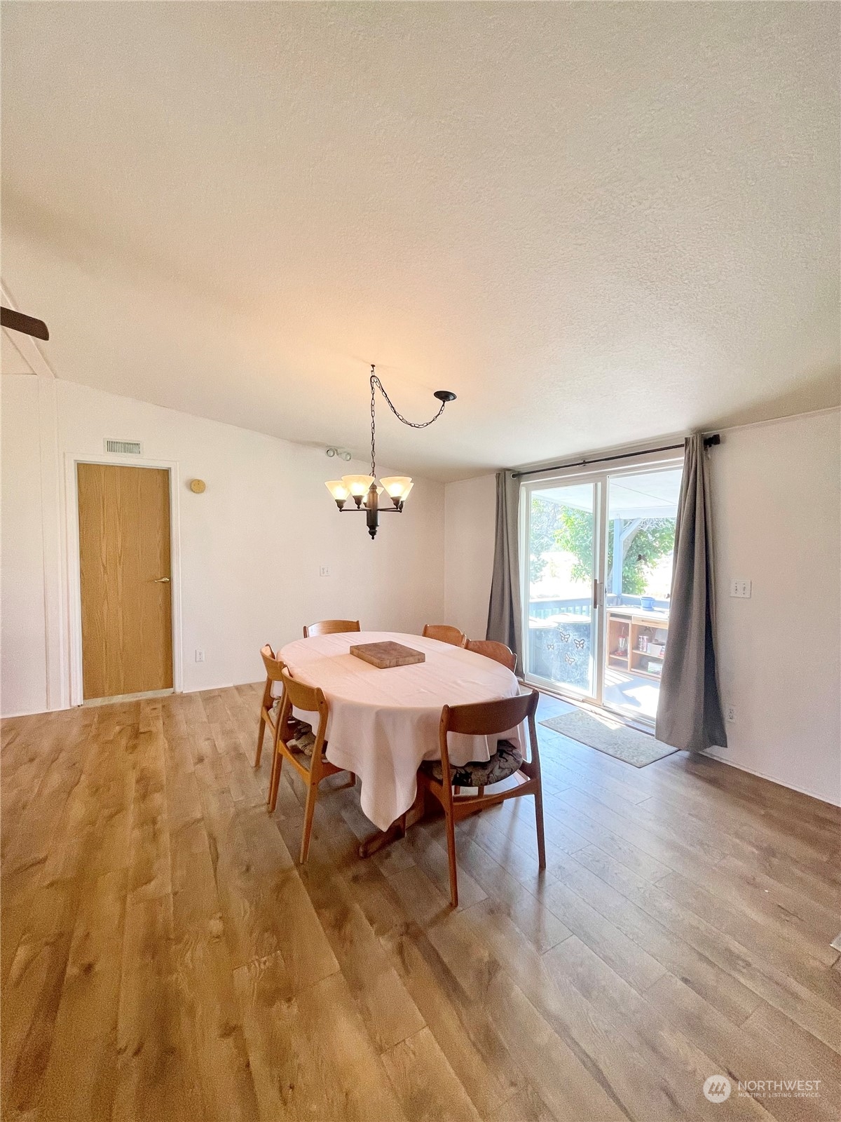 92 Danker Cutoff Road Okanogan, WA 98840 - Photo 6 of 35 a dining room with a wooden table and chairs
