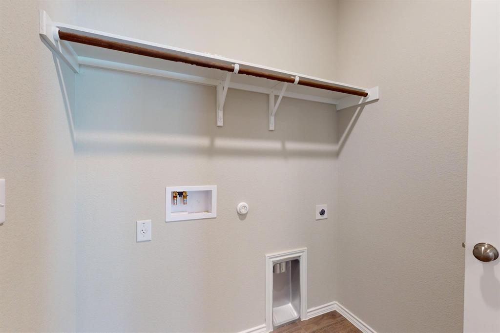 4509 Beacon Bay Drive Austin, TX 78747 - Photo 17 of 30 Laundry room with gas dryer hookup, hookup for a washing machine, hookup for an electric dryer, and wood finished floors