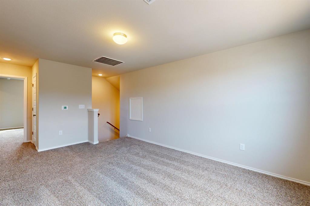 4509 Beacon Bay Drive Austin, TX 78747 - Photo 19 of 30 Unfurnished room featuring light colored carpet and baseboards