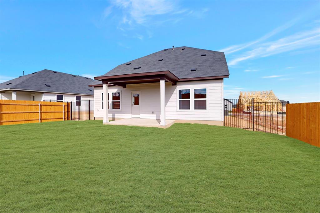 4509 Beacon Bay Drive Austin, TX 78747 - Photo 22 of 30 Back of house with a patio and a fenced backyard