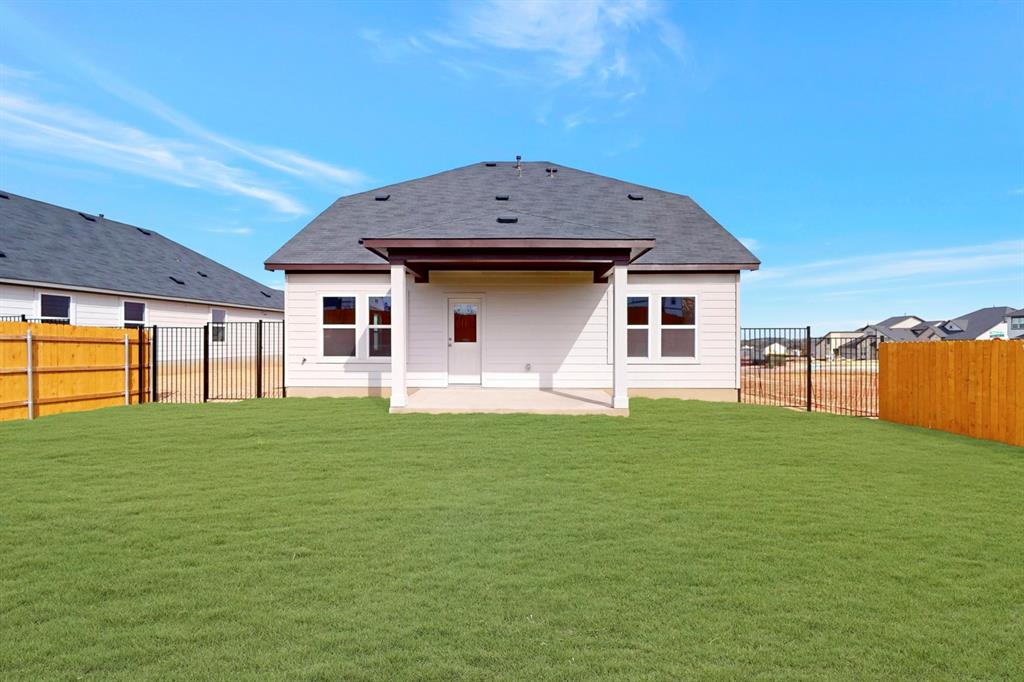 4509 Beacon Bay Drive Austin, TX 78747 - Photo 23 of 30 Rear view of house featuring a patio and a fenced backyard