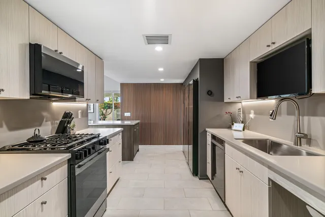 a bathroom with a sink a mirror and a shower