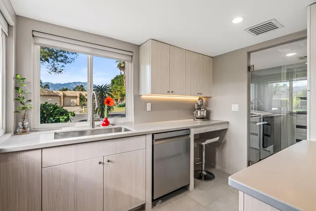 a view of a swimming pool with an outdoor space and garden