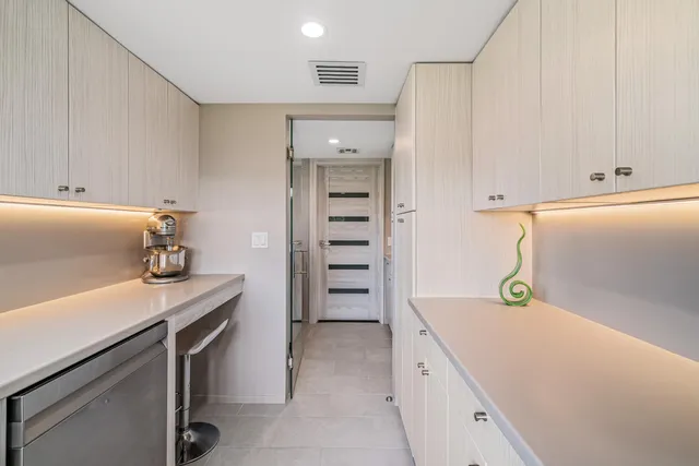 a view of a house with swimming pool and sitting area