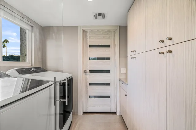 a view of a livingroom with furniture and a flat screen tv