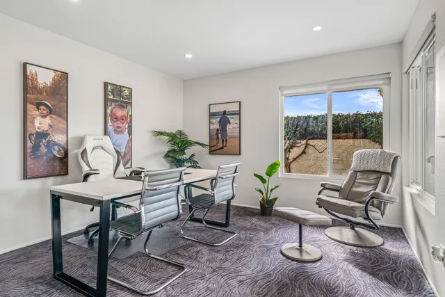 a view of a living room and floor to ceiling window