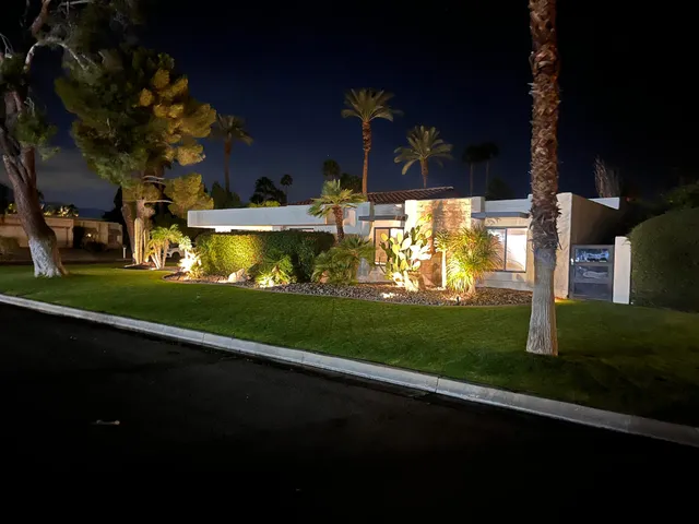 a kitchen that has a sink and a stove top oven