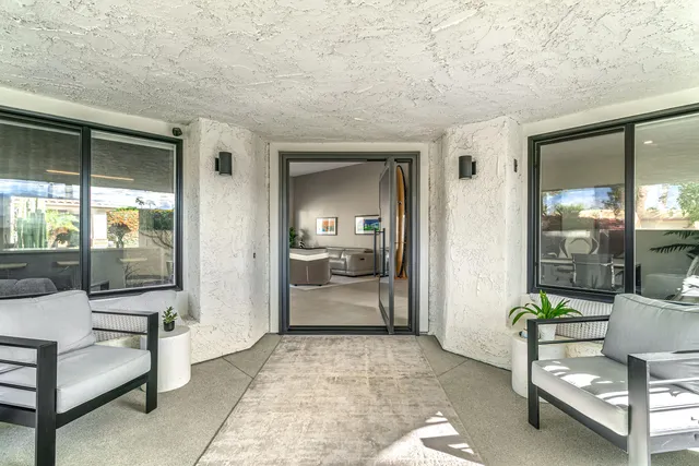 a living room with furniture and a window
