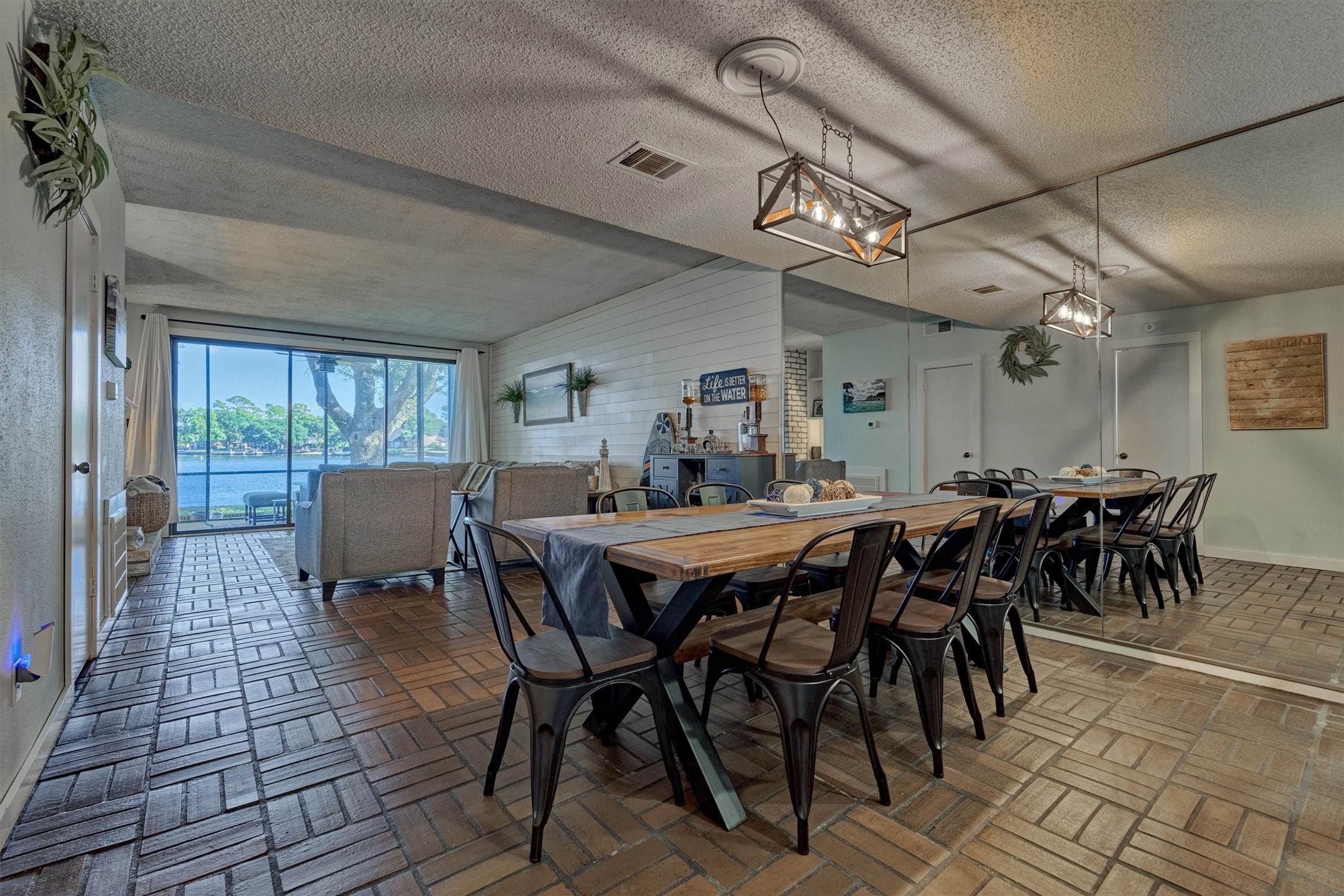 1428 Bowsprit Point Willis, TX 77318 - Photo 15 of 47 Original brick flooring brings a warm tone to the home. The open dining and living area is a large space-great for entertaining friends and family.