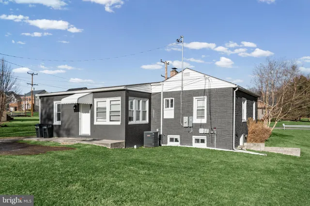 a view of a backyard with large trees