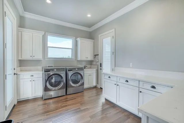 a living room with furniture a flat screen tv and a window