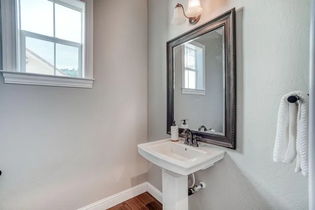 a view of a house with pool and sitting area
