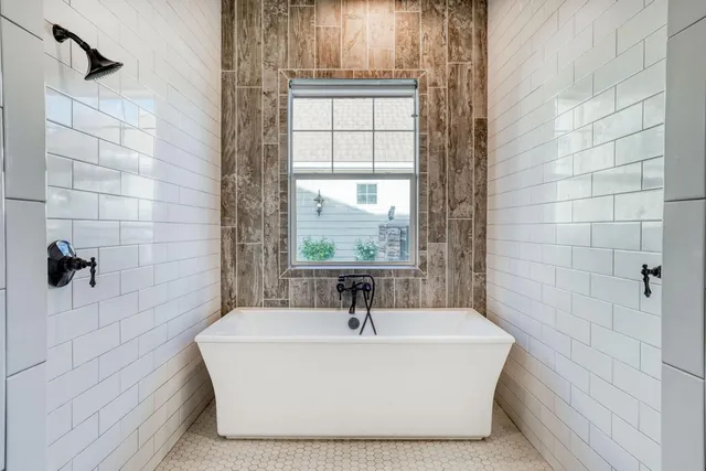 a view of a house with potted plants