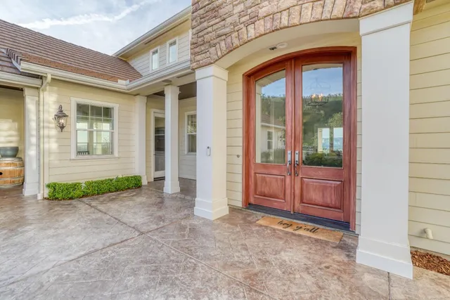 a view of a city with lush green forest