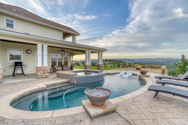 a view of a big yard with lots of bushes