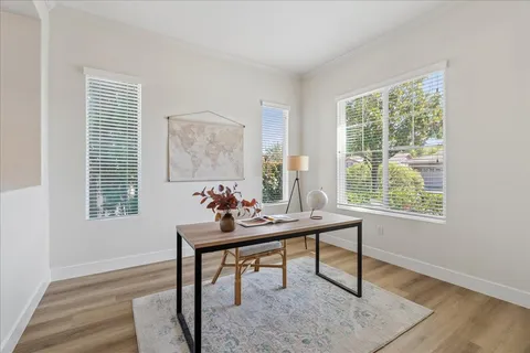 a work room with furniture and windows