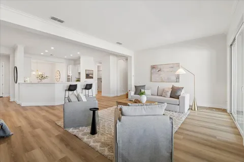 a living room with furniture and a table