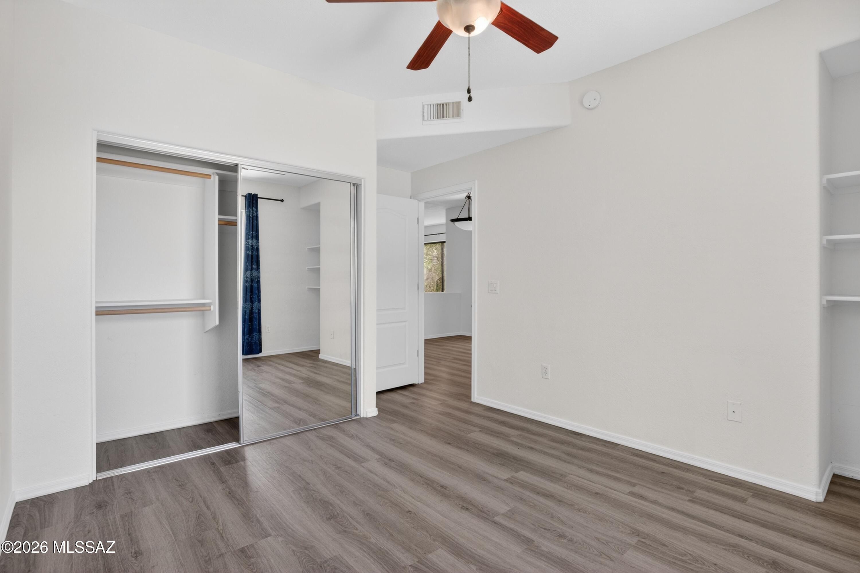 2550 East River Road, Unit 4204 Tucson, AZ 85718 - Photo 24 of 36 a view of empty room with wooden floor