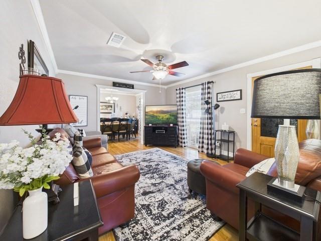 516 East 6th Street Irving, TX 75060 - Photo 6 of 40 a living room with furniture and wooden floor