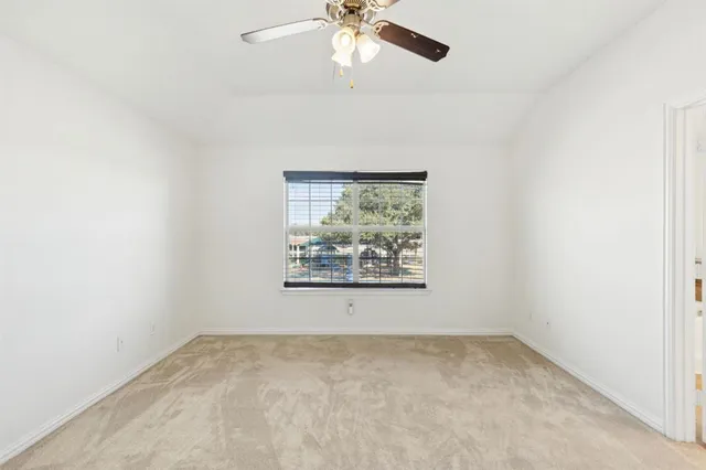 a view of an empty room with stairs