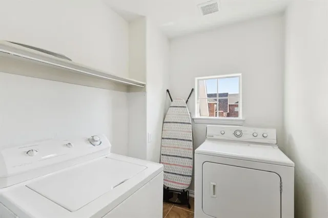 a bathroom with a sink a toilet and shower curtain
