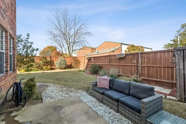 an empty room with wooden floor and window
