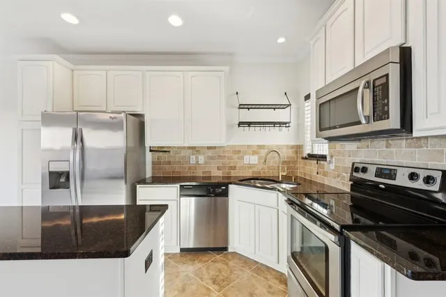 a view of kitchen with microwave and stove