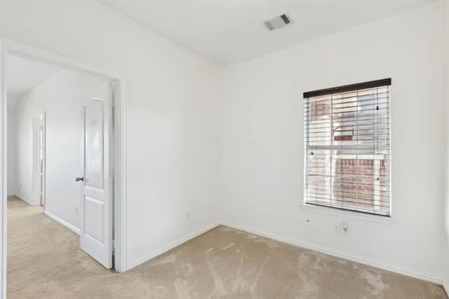 a kitchen with stainless steel appliances granite countertop a stove top oven a refrigerator and a sink