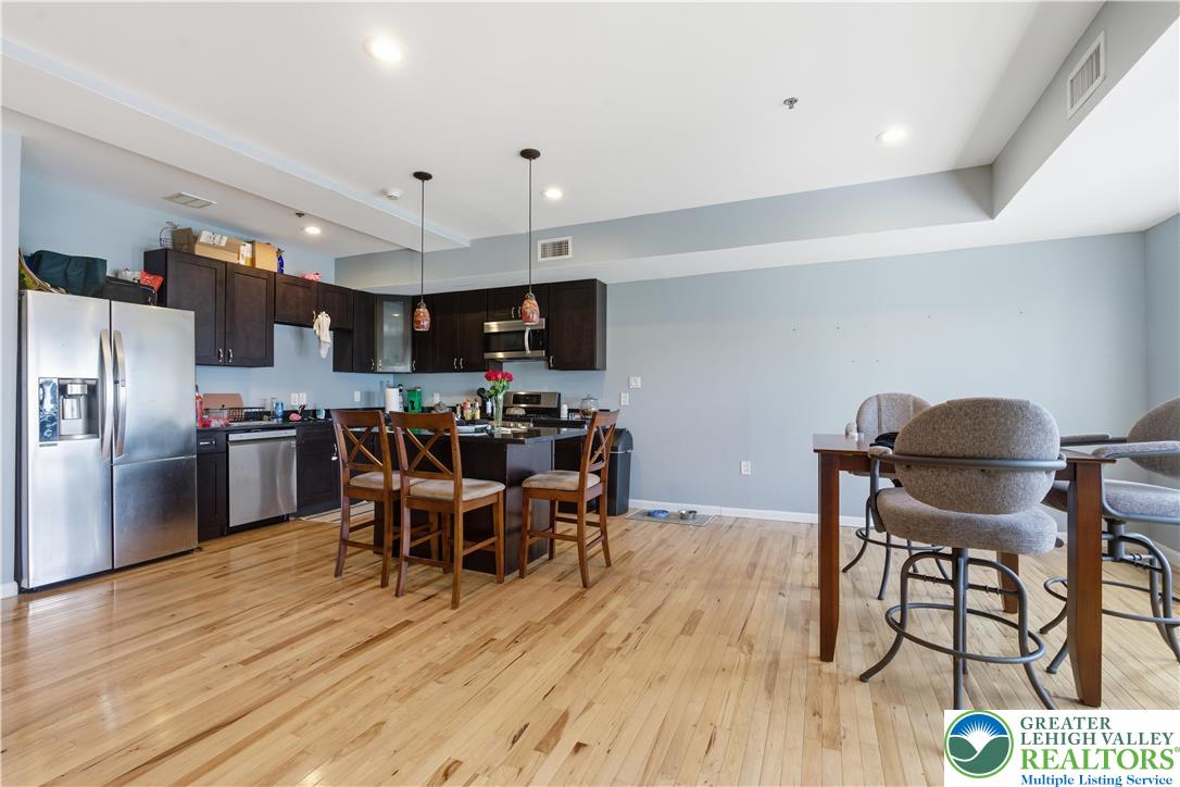 623 Walnut Street, Unit A2 Easton, PA 18042 - Photo 5 of 21 a view of a dining room with furniture and wooden floor