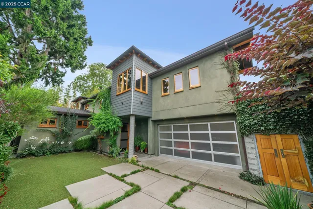 a front view of a house with a garden